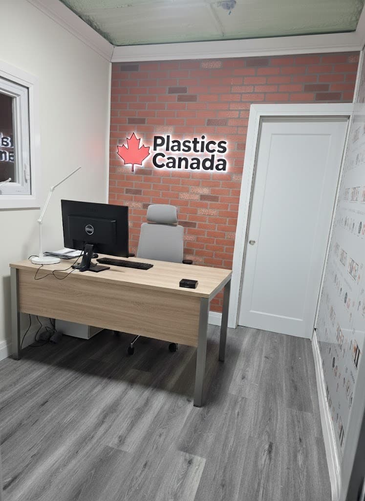 Da Vinci Plastics office with brick wall logo and modern workspace